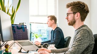 Two men sitting at desk